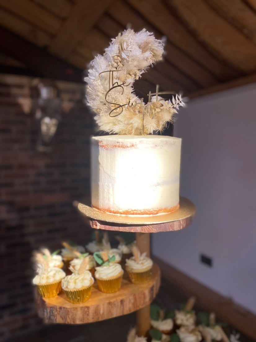 Dried floral half moon cake topper